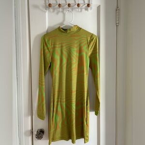 a line mini dress with lime green and orange acid style print